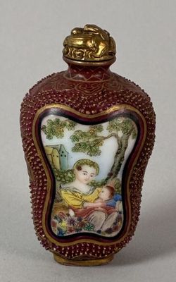 a small bottle with a picture of a child on it