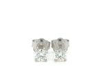 a pair of diamond stud earrings on a white background