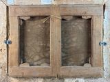 a picture of a wooden window with two glass panes
