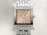 a silver watch with a pink face on a bracelet