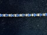 an image of a blue and white bracelet with diamonds