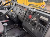 a view of the inside of a construction vehicle from the driver ' s seat