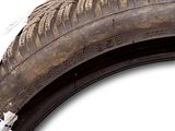 a close up of a tire on a white background