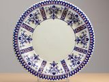 an image of a blue and white plate on a wooden table