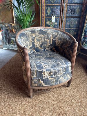 a chair that is sitting in the middle of a room