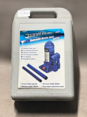an image of a blue hydraulic bottle jack in a case