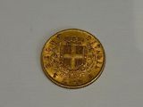 an image of a gold coin on a white surface