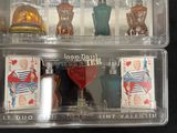 a plastic box with a set of miniature figurines in it