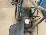 an image of a bag and some tools in a garage