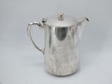 a silver coffee pot on a white background