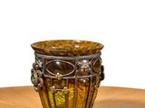 a vase that is sitting on a wooden table