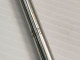 a close up of a pen laying on top of a piece of paper
