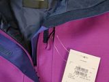 the back of a purple jacket with a tag on it