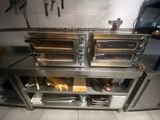 two ovens that are sitting on top of a counter