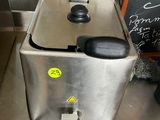 a machine that is sitting on a counter in a kitchen