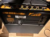 a guitar amp sitting on top of a hard wood floor