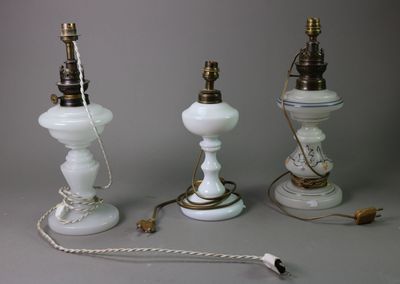 three lamps that are sitting next to each other on a table
