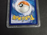 a close up of a pokemon trading card in a plastic case