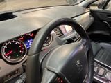 steering wheel and dashboard of a car on display in a showroom