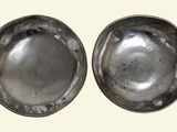 pair of antique silver plated bowls on a white background