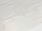 a white table cloth with a star design on it