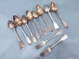 six silver spoons and six forks are arranged in a row
