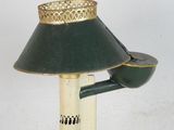 a green lamp that is on top of a pole