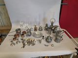 a table that has a lot of silver items on it