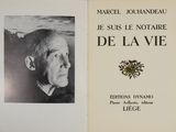 an old book with a black and white photo of a man ' s face