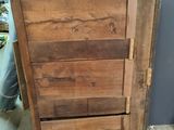 a wooden door that is sitting on a wooden floor