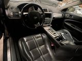 a view of the inside of a car from the driver ' s seat