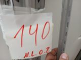 a hand that is holding a piece of paper with the number forty on it