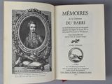 an open book with a picture of a man in a picture frame