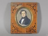 portrait of a man in a black coat in a wooden frame