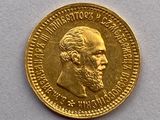 l'image d'une pièce d'or sur laquelle figure le visage d'un homme