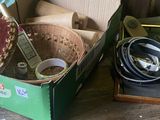 a green box filled with assorted items sitting on a table