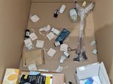 a box full of items that are sitting on the floor