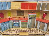 a toy kitchen with a stove, refrigerator, sink, and oven