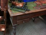 a table with a chair and a table top with a picture on it