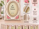 picture frame with pink roses and pearls on it and a lot of cards in front of it