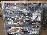 a metal cart with many items in it in a warehouse