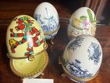 three eggs are sitting on a table with a price tag in front of them
