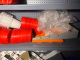 many plastic cups on the shelf and plastic cups on the shelf