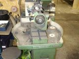 a machine that is sitting on a table in a garage