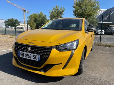 the yellow car is parked in the parking lot next to a fence