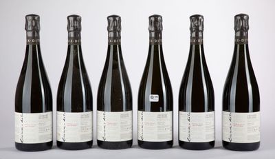 six bottles of wine are lined up in a row