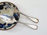 two spoons and a fork in a bowl
