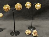 three pairs of gold and pearl earrings and a pair of earrings