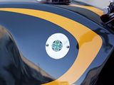 a close up of a motorcycle with a yellow and black stripe