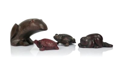 three bronze figurines of bears and a bear and a bear cub
